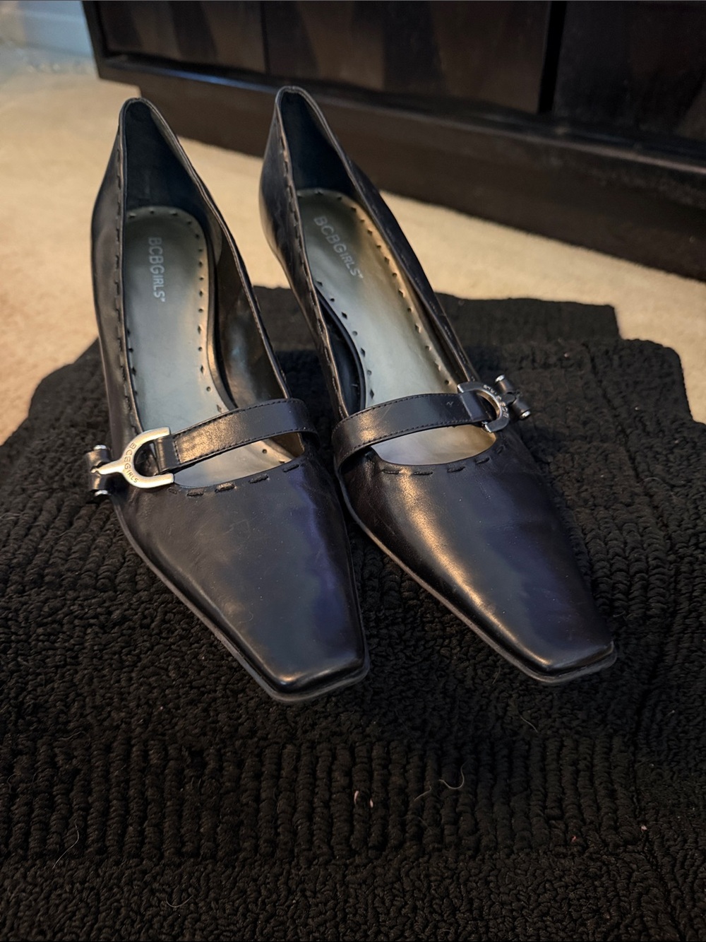 BCBGirls Black Pointed-Toe Mary Jane Heels with Silver Buckle